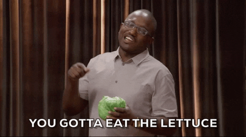 GIF of Hannibul Buress pointing at a head of lettuce in his hand and saying "You gotta eat the lettuce."