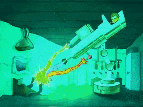Spongebob wearing a helmet and googles, operating a large laser while shouting "More power".