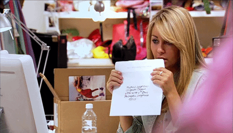 Lauren Conrad licking an envelope