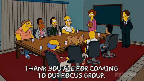 Simpsons characters sit down to a focus group. Head speaker thanks them all for coming. 