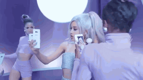 Ariana Grande music video phone selfie focus