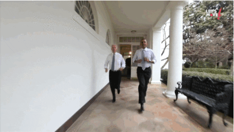 Barack Obama and Joe Biden running through the White House.
