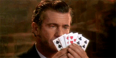 Gif of a man facing his cards the wrong way in a game of cards -- school performance mishaps
