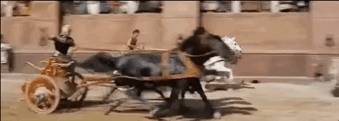 gif of chaotic chariot race from "Ben Hur" starring Chuck Heston