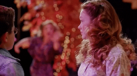 A human GIF featuring a couple of people standing next to each other at a Quinceanera celebration.