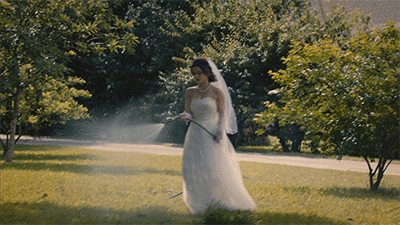 Bride watering lawn, LawnGuru biggest tips. 