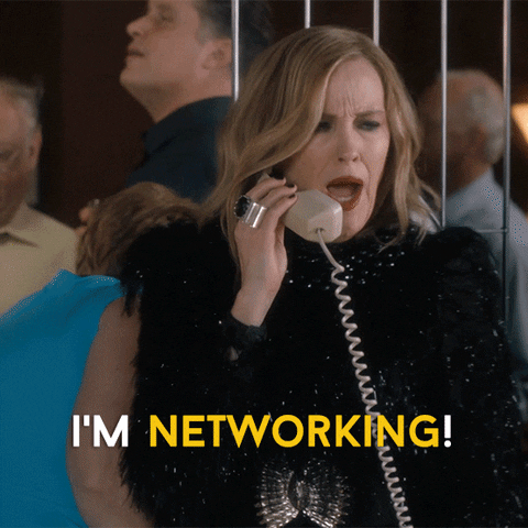 Gif of Schitt's Creek character, Moira Rose, talking on the phone saying "I'm networking!"