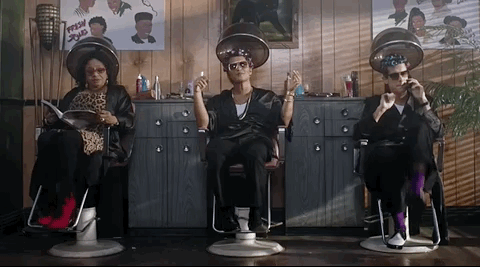 a GIF of Bruno Mars under a hair dryer from the music video Uptown Funk