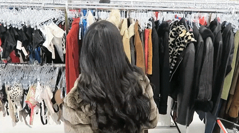 Girl in a Value Village spins around to show off her outfit