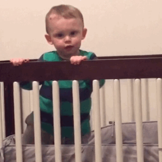 baby dancing inside crib