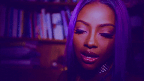 Justine Skye with lip gloss on her lips