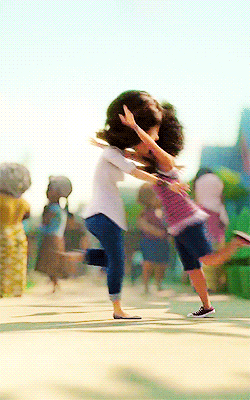 An animation depicting a mother swinging her daughter in a heartfelt hug. Via Giphy.com