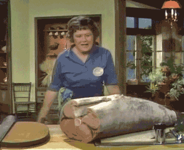 animated gif of Julia Child looking exasperated with a huge fish
