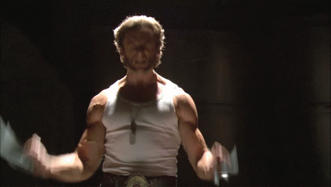 A short GIF image showing X-Men's Wolverine flexing with his claws out.