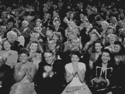 black and white gif of audience clapping