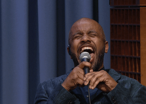 Singer belting into a microphone on The Tonight Show, then going quiet