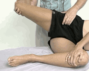 A sports massage therapist stretching an athletic individual for routine maintenance.
