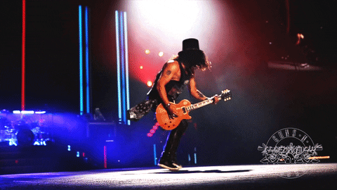 GIF of guitar player Slash dancing